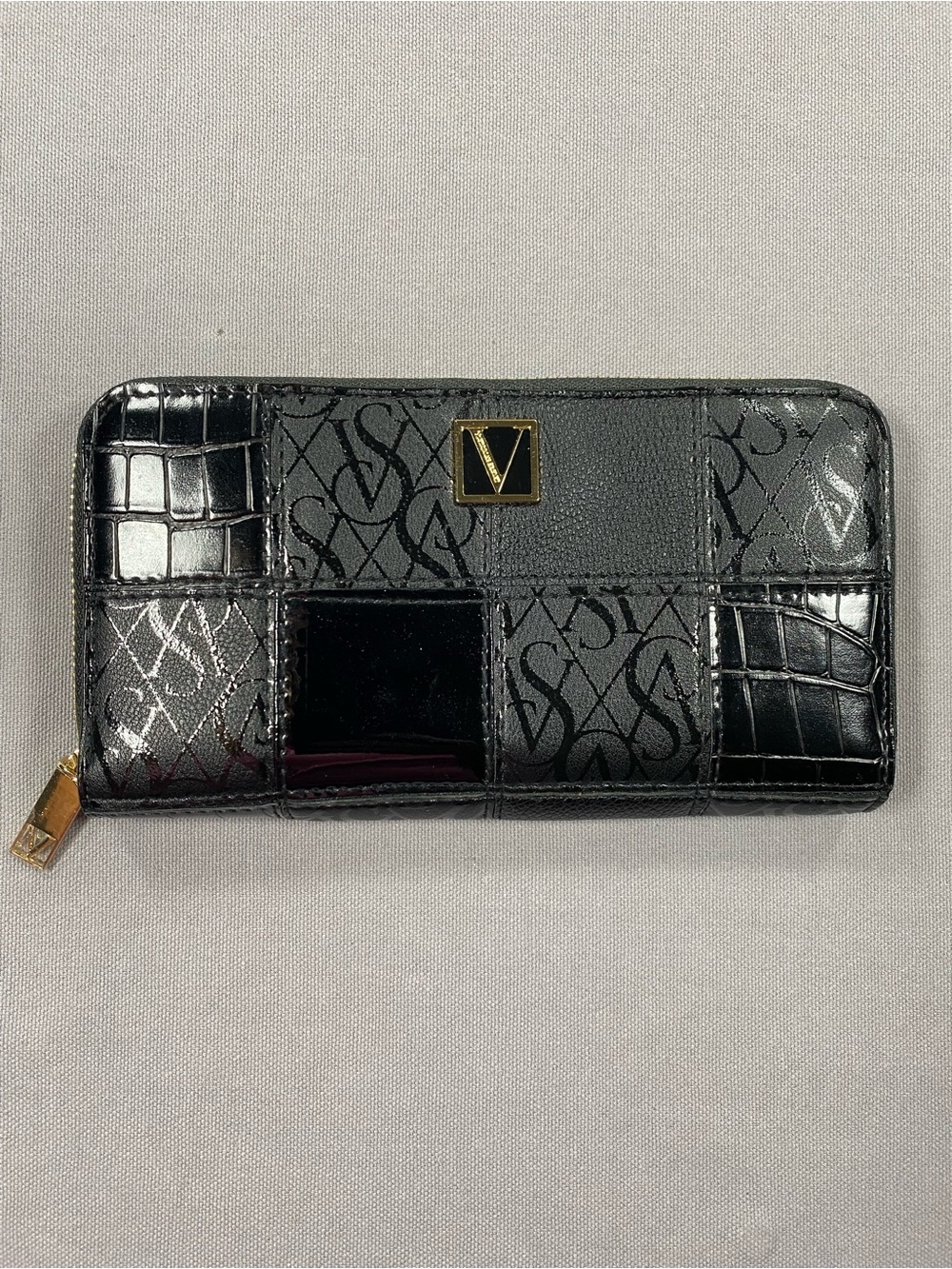 Victoria's Secret Black Patchwork Zip-Around Wallet with Gold Emblem